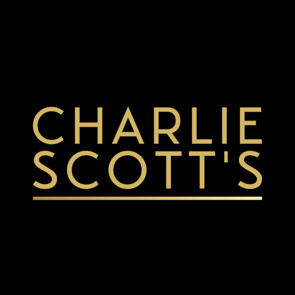 Charlie Scott’s logo in square photo format. The logo has a completely black background that spreads the full width of the image. Charlie Scott’s is written in block capital letters, in gold, in the centre of the logo. The logo is underlined by a single gold line that spans the full width of the text.