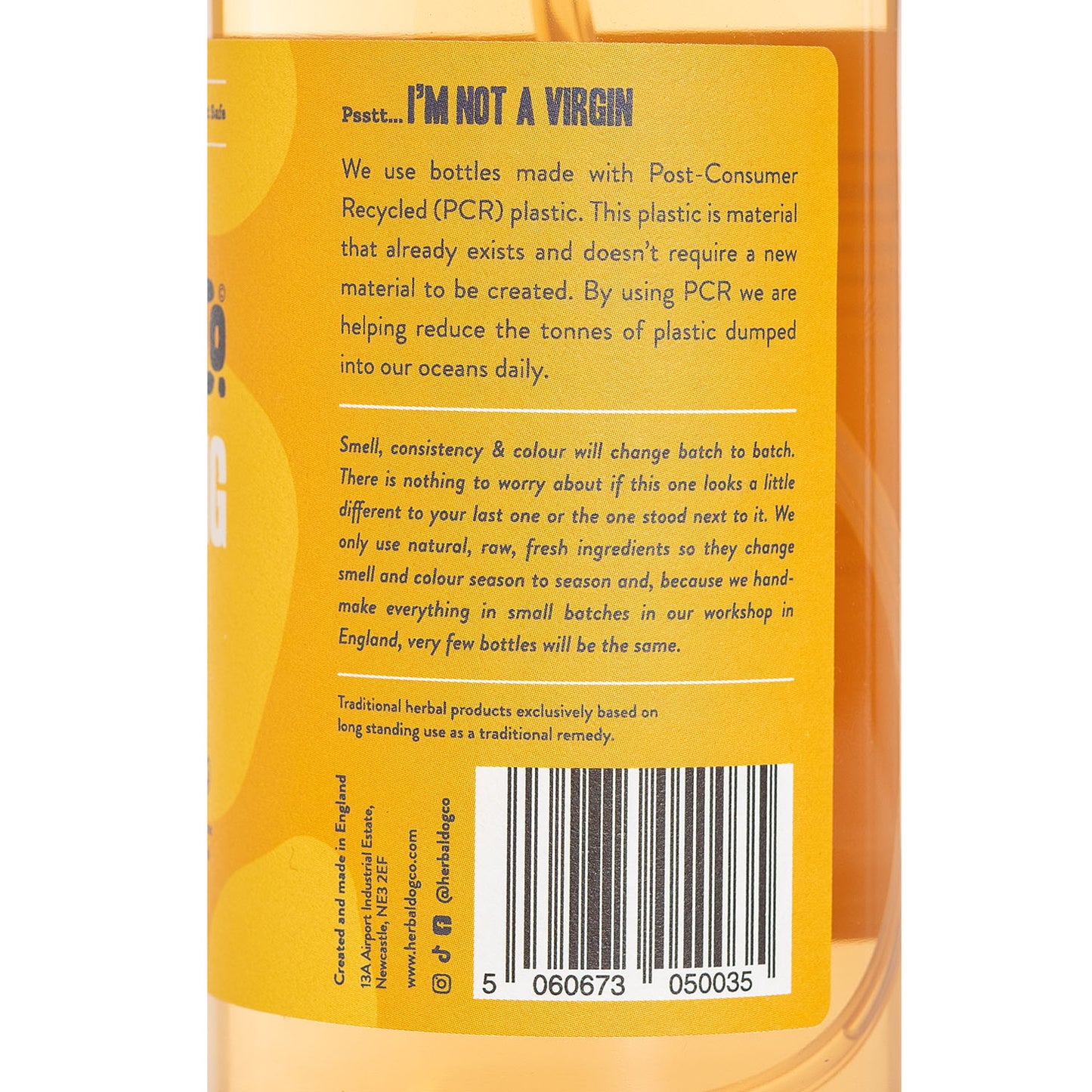 A bottle of stop matting brushing spray information by Herbal Dog Co. on an all white background.