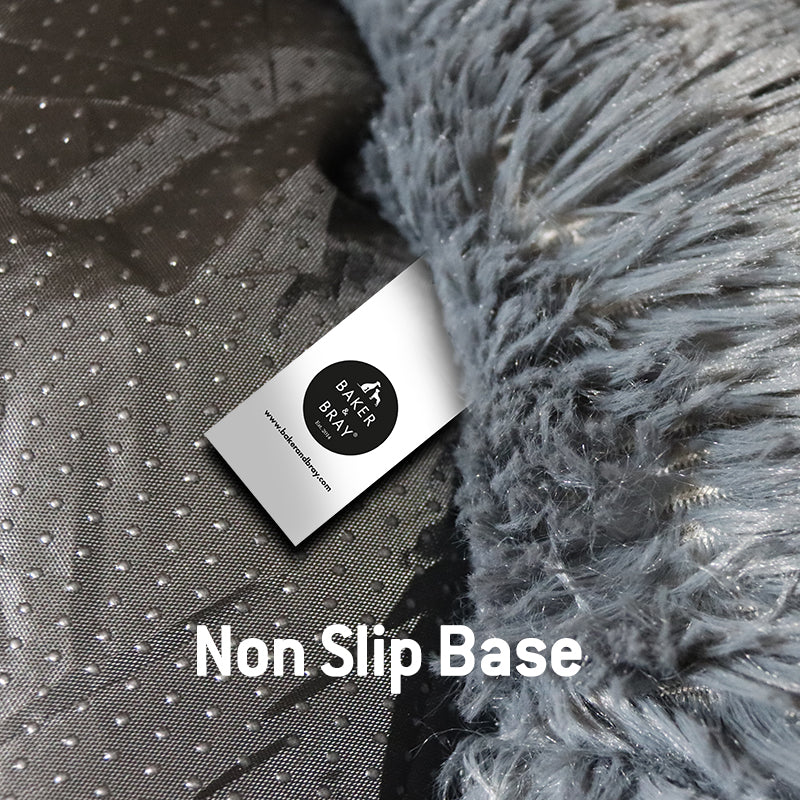 Close up of Baker & Bray dark grey calming donut dog bed showing non slip base