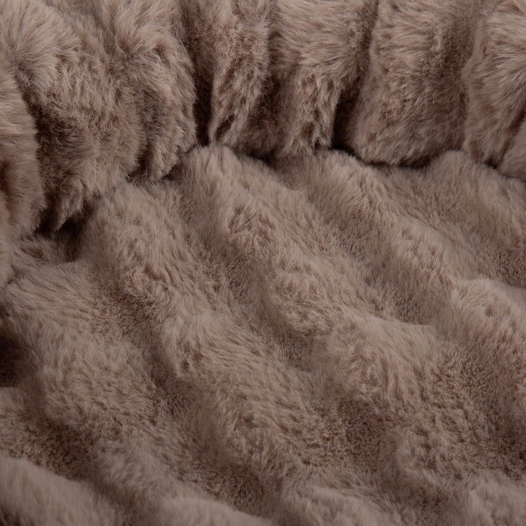 Close-up of a brown taupe, textured fabric  on a cat tree tower