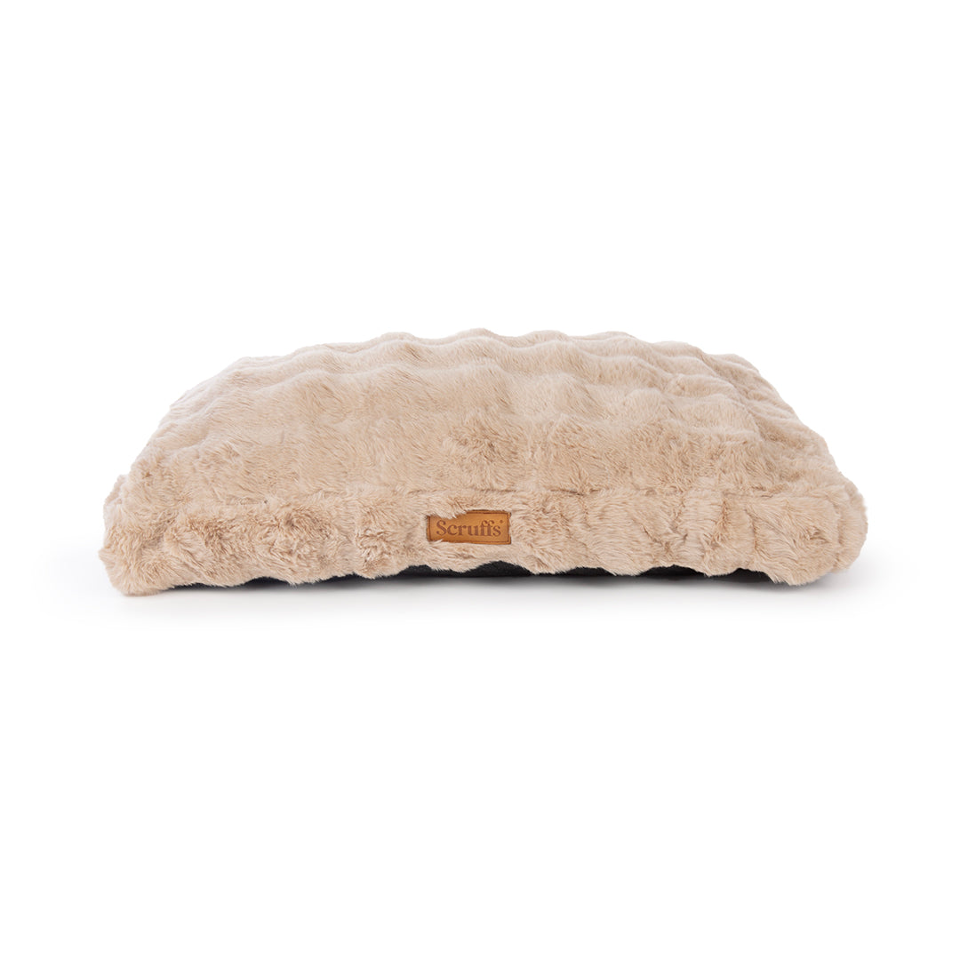 Beige fluffy dog mattress with a brand logo on a white background