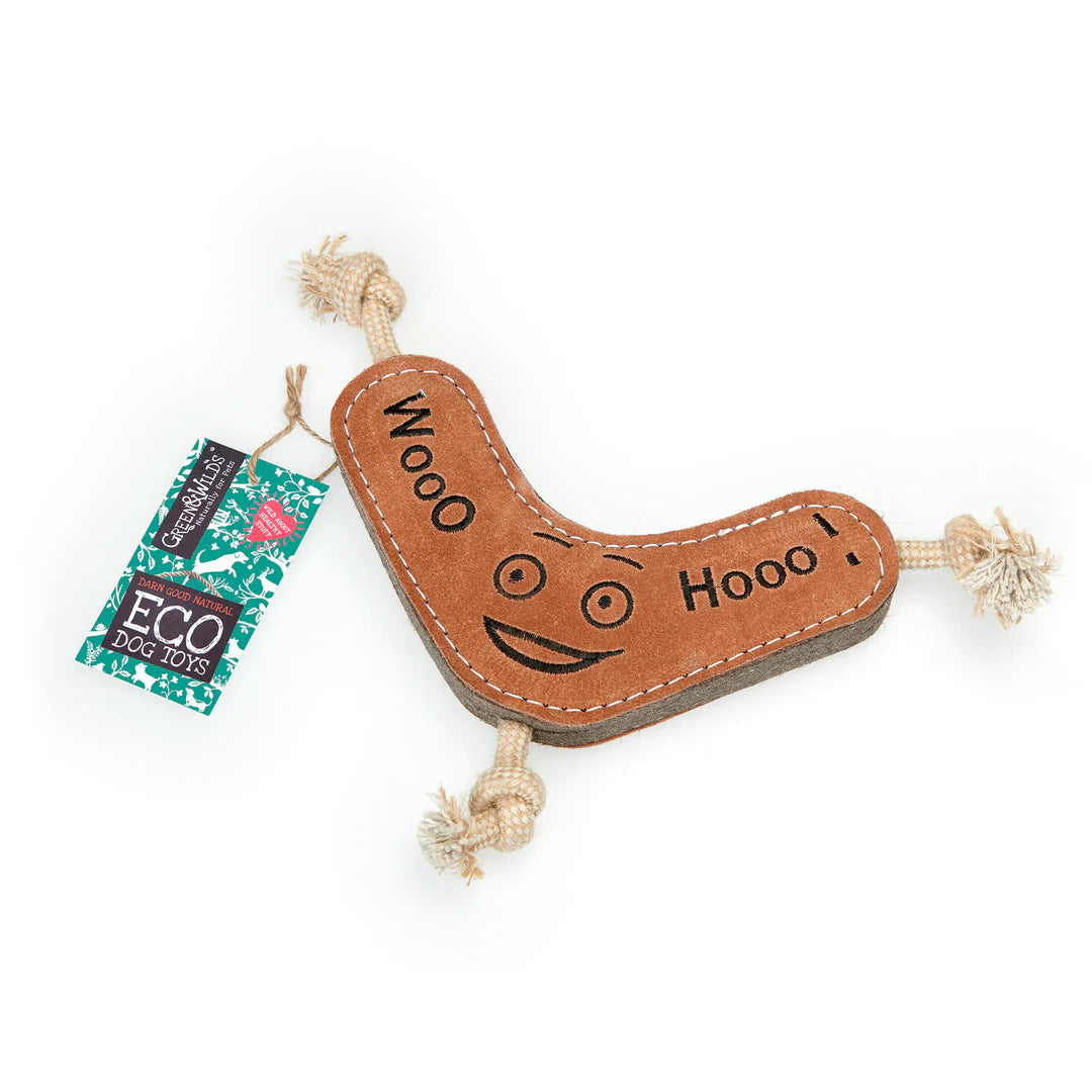 A plush eco dog toy resembling a boomerang made of jute and suede on an all white background.
