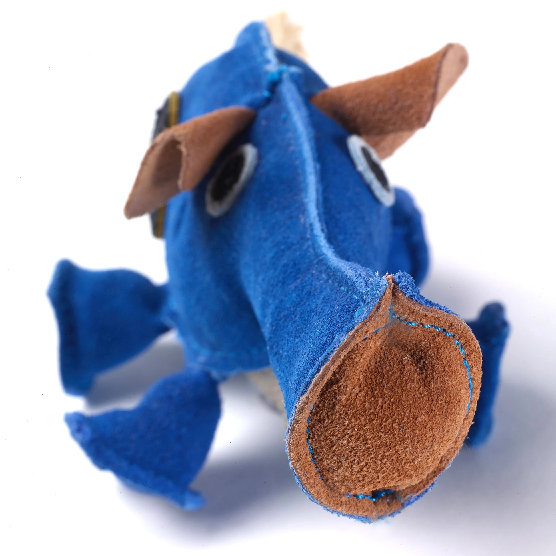 Blue and brown plush eco dog toy on a white background.