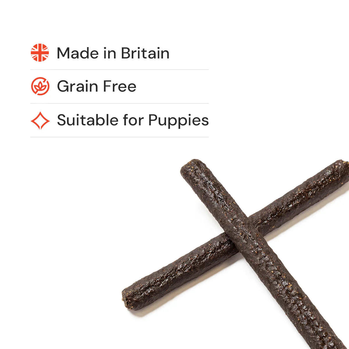 Two gourmet sticks natural dog treats on an all white background with three benefits in the top left corner.