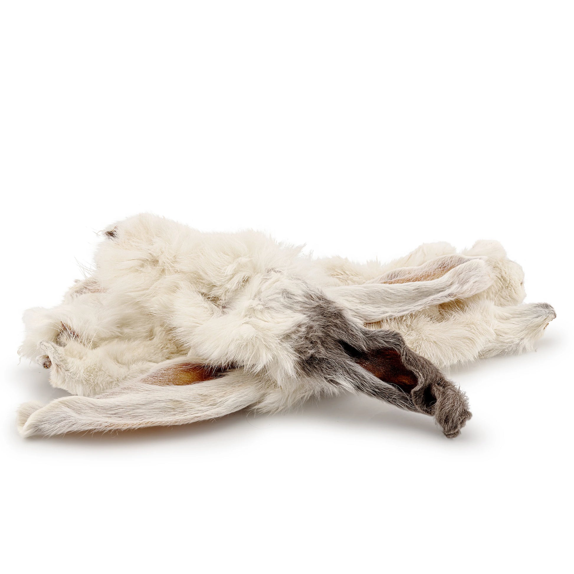 A stack of white hairy rabbit ears natural dog treats on an all white background.