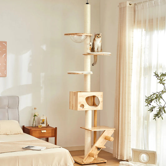 Floor to ceiling wooden cat play centre in a bedroom with a cat sitting on one of the platforms