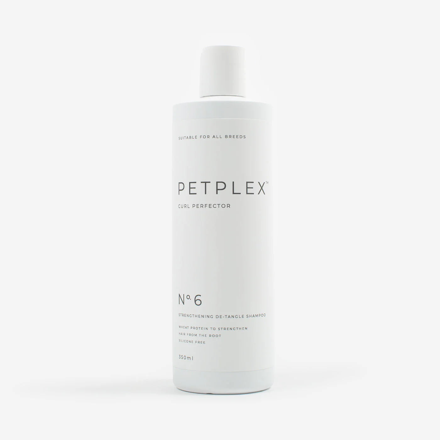Petplex curly coat dog shampoo bottle on a white background