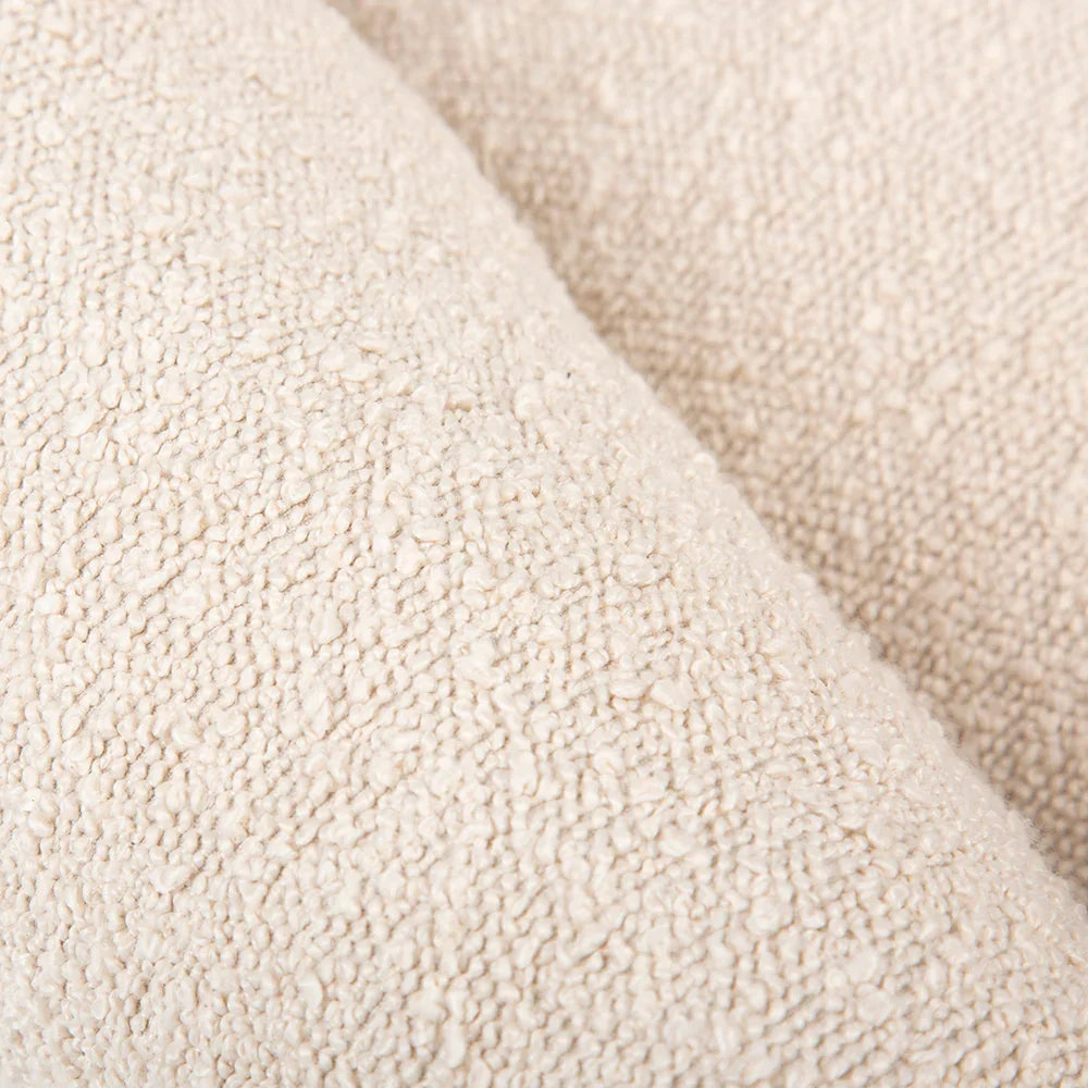 Close up of ivory boucle outer fabric with soft textured finish