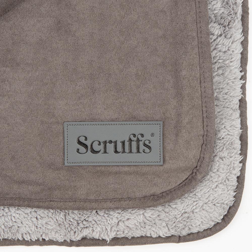 Close-up of the Scruffs logo and soft sherpa blanket edging