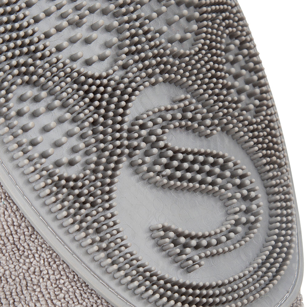 Close-up of rubber grooming comb texture on dog drying mitt