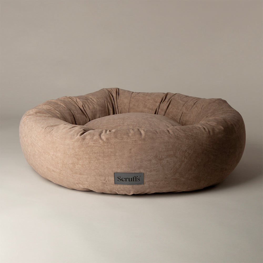 Scruffs Oslo donut dog bed in desert sand on white background
